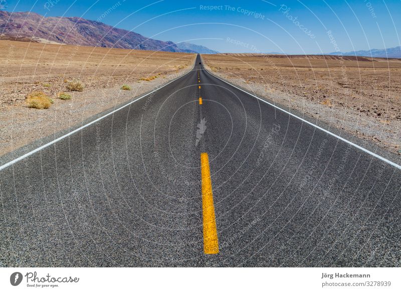 Death Valley road straight across the desert Vacation & Travel Trip Mountain Nature Landscape Sky Horizon Street Highway Line Long Speed Blue Yellow Black