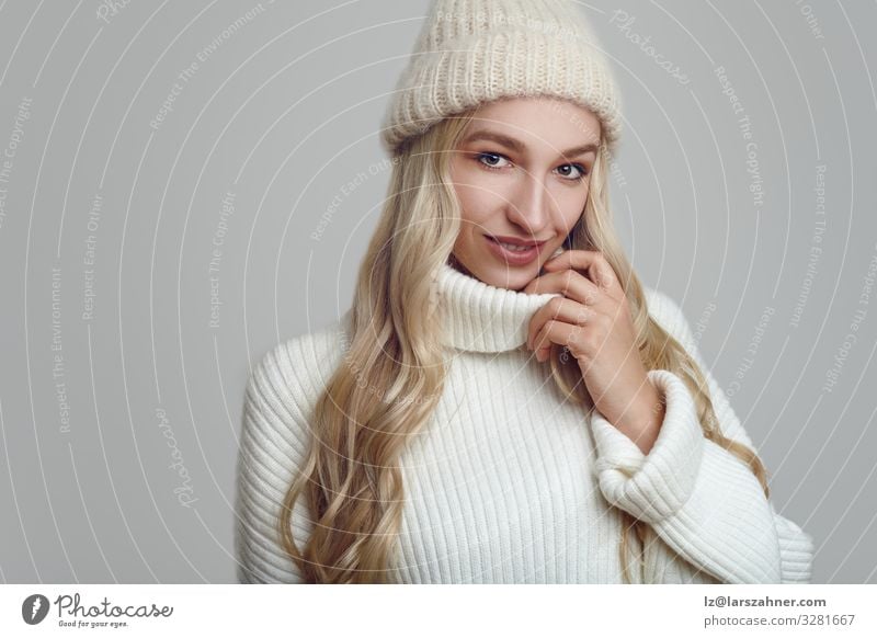 Beautiful woman in white knitted sweater and hat Happy Face Winter Woman Adults 1 Human being 18 - 30 years Youth (Young adults) Warmth Sweater Hat Blonde