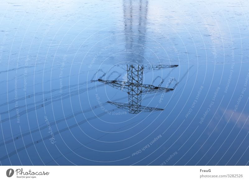 upside down| Reflection of a power pole Water Ice thin ice Winter Pole Electricity pylon high voltage High voltage power line Transmission lines