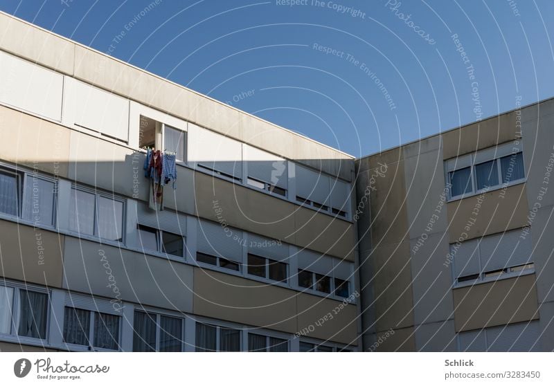 Eco tumble dryer Renewable energy Solar Power Energy crisis Deserted High-rise Window Facade Blue Gray White Environment Environmental protection Town Laundry