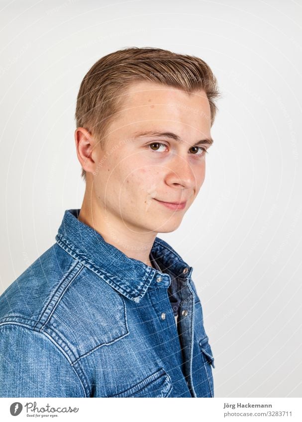 cute smiling boy posing in studio Joy Happy Beautiful Face Human being Boy (child) Man Adults Youth (Young adults) Shirt Jeans Smiling Friendliness Cute White