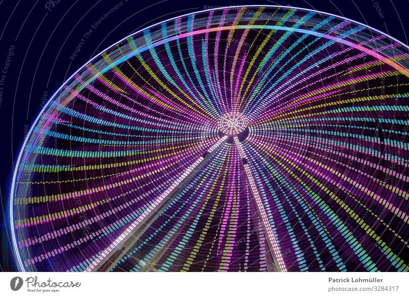 Swing in the round Leisure and hobbies Ferris wheel Night sky Steel Glittering Gigantic Beautiful Blue Green Moody Joy Movement Energy Relaxation Round