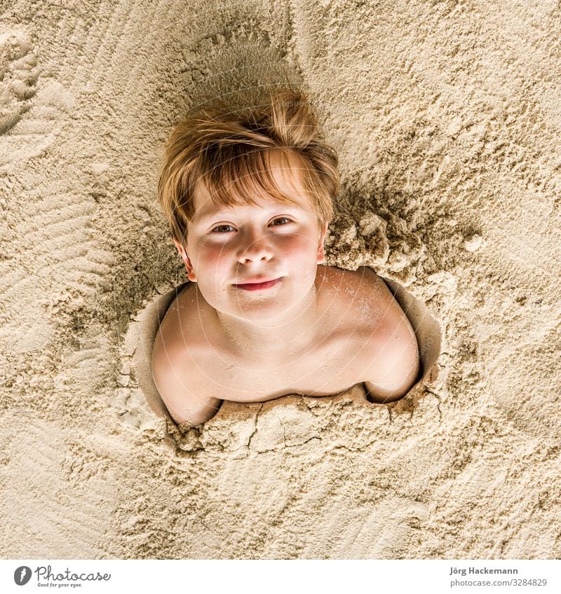 happy young boy covered by fine sand Joy Happy Playing Vacation & Travel Beach Child Boy (child) Youth (Young adults) Sand Laughter Friendliness Cute Ko Samet