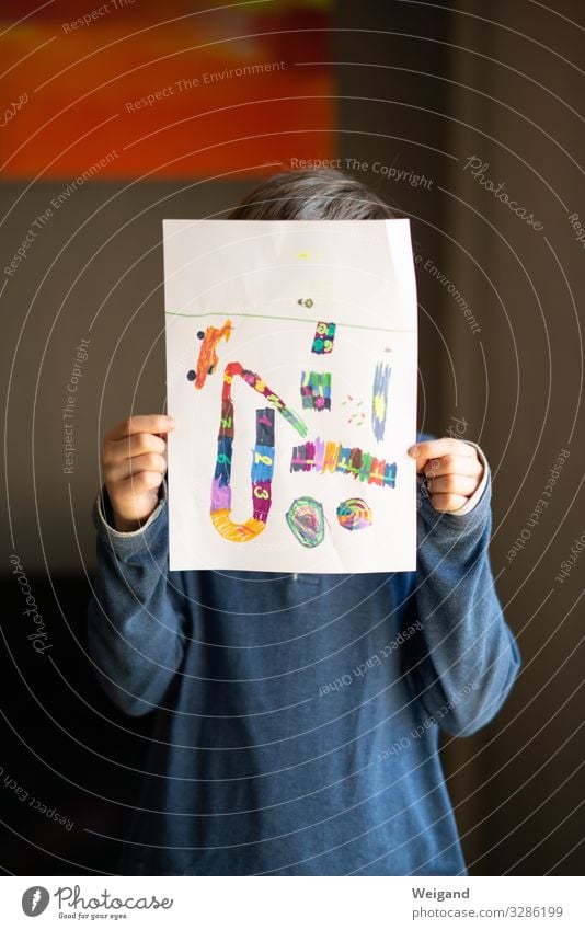 Boy with self-painted picture Parenting Education Kindergarten Child School Study Classroom Schoolchild schuler Boy (child) 1 Human being Draw Paper