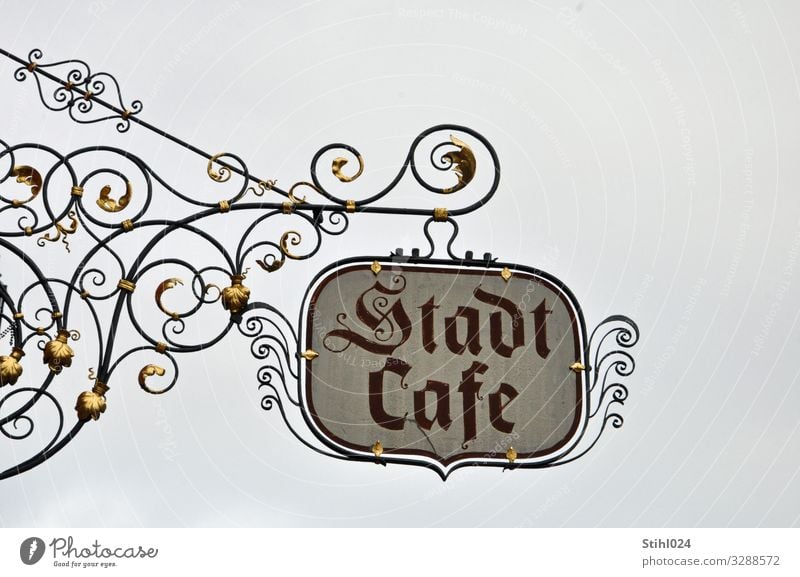 wrought-iron shop sign "Stadtcafé" Nutrition To have a coffee Café Trip City trip feet advertising sign Signs and labeling Signage Warning sign Eating Drinking