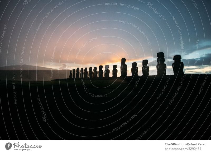 MOAI - Easter Island - Sunrise Nature Landscape Blue Black moai Silhouette Cairn Rain Moody Hill Beaded Statue Stone Build Culture Tourism Clouds Colour photo