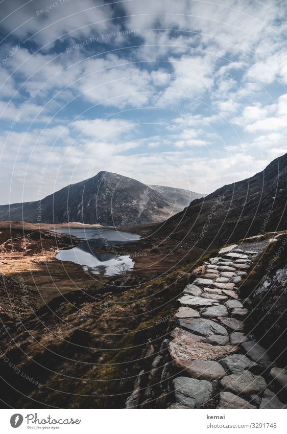 Mountain trail in Snowdonia, Wales mountains Peak path off Stone Authentic untreated Nature natural beauty Hiking Deserted Loneliness Lake mountain lake Clouds