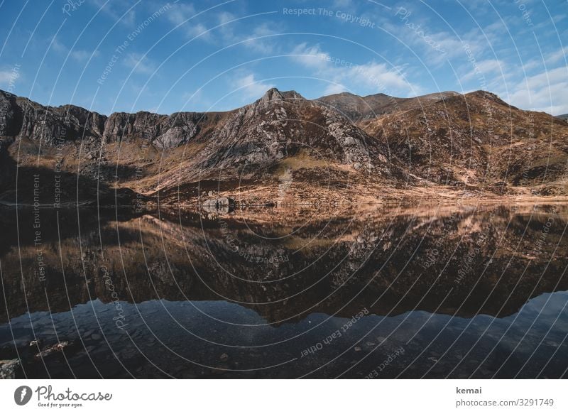 Mountain lake in Snowdonia, Wales mountains Peak Stone Authentic untreated Nature natural beauty Hiking Deserted Loneliness Lake mountain lake Clouds Sky wide