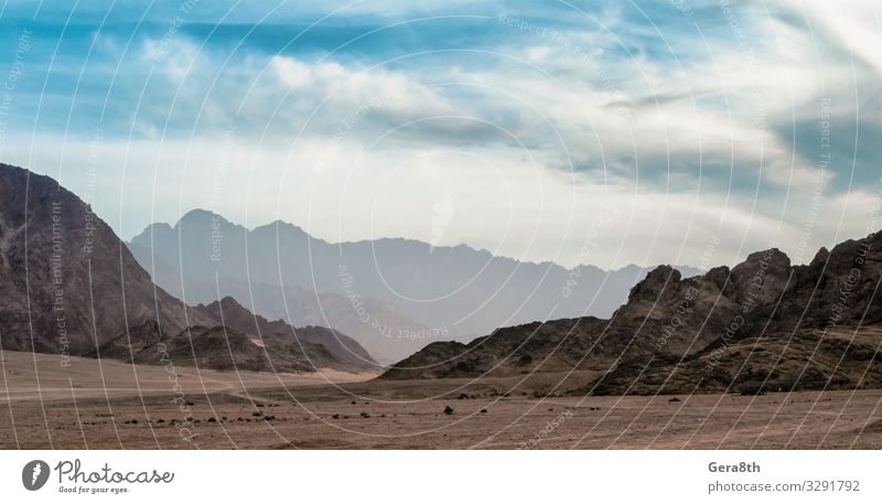 panoramic view of desert with rocky mountains in Egypt Exotic Vacation & Travel Tourism Trip Mountain Nature Landscape Sky Clouds Fog Rock Stone Dark Colour