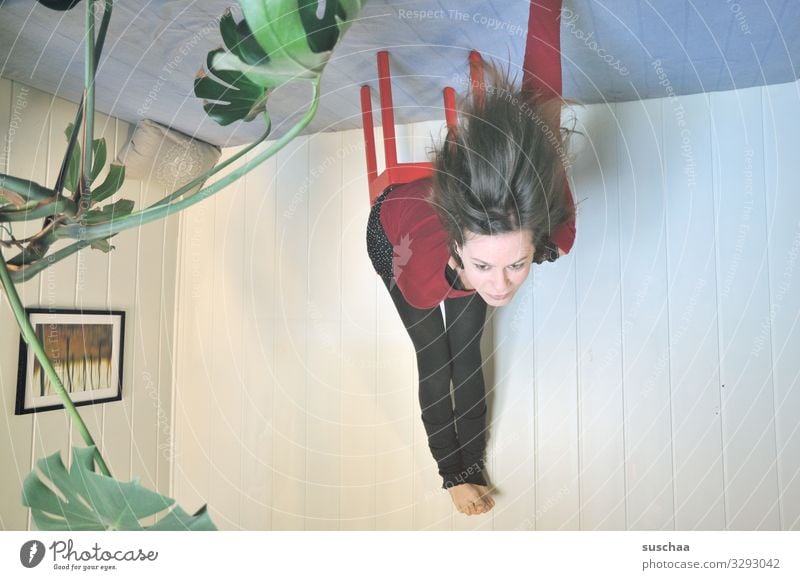 sitting dangling from the ceiling l lifted Woman at home room Corner of the room Houseplant Wall (building) Chair Sit Hang Hair and hairstyles False upside down