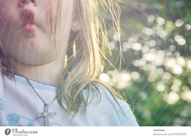 rabbit's foot Child Girl Infancy Face Mouth Children`s mouth Hair and hairstyles Disheveled Detail Sweet Playing hare's nose Grimace Exterior shot Wild