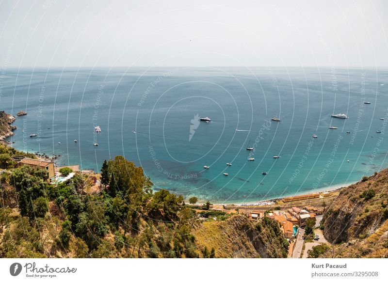 Turquoise Mediterranean sea in Taormina Sicily Italy Lifestyle Luxury Exotic Relaxation Calm Vacation & Travel Tourism Trip Freedom Cruise Summer