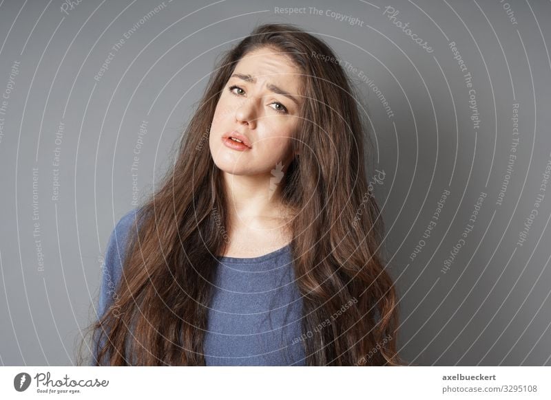 unhappy sad young woman frowning Human being Feminine Young woman Youth (Young adults) Woman Adults 1 18 - 30 years Sweater Brunette Long-haired Sadness