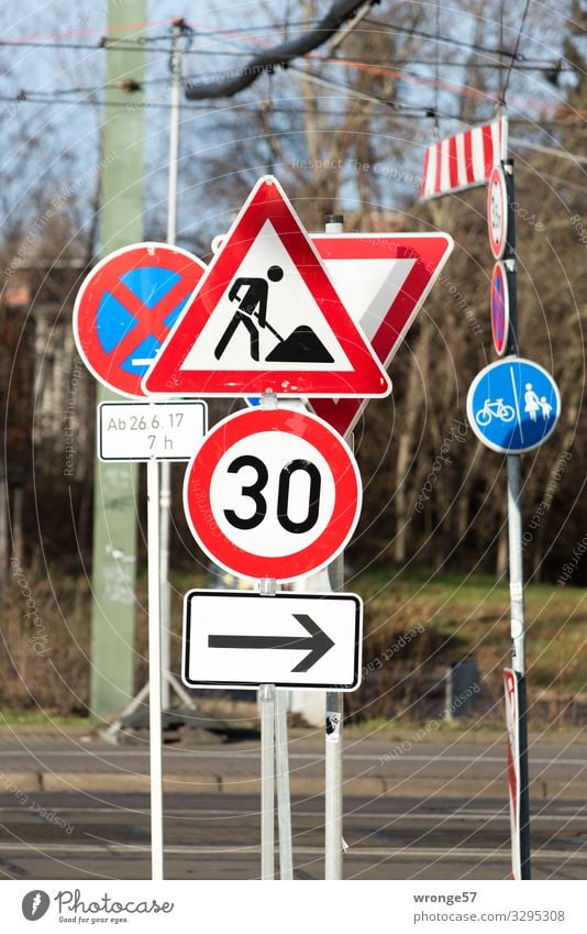 signpost forest Town Transport Road traffic Road sign Blue Multicoloured Red Black White Attentive Stress Mobility Sign forest Review Clear Chaos