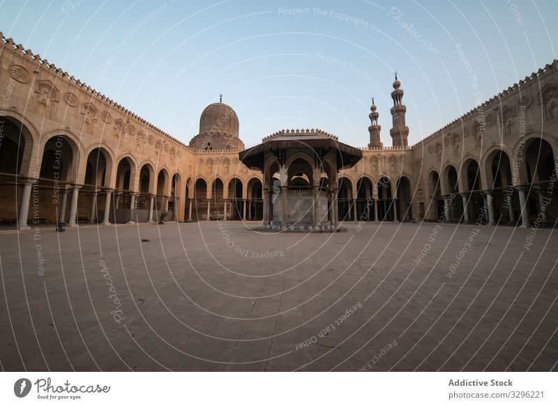 Square ornamental roof of ancient mosque under sunlight square sultan al-muayyad mosque minaret city architecture muslim islamic religion culture exterior