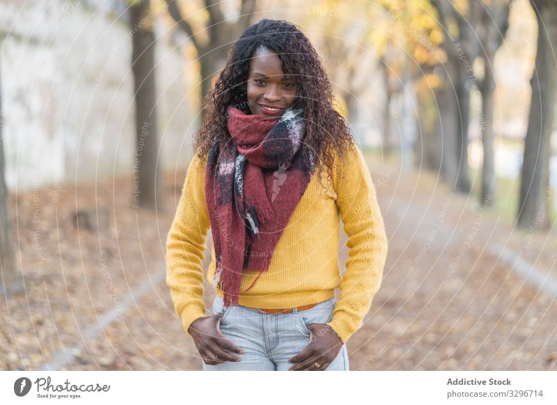 Black woman standing in alley in park leaves female road autumn nature stylish black african american natural street freedom energy yellow inspiration fashion