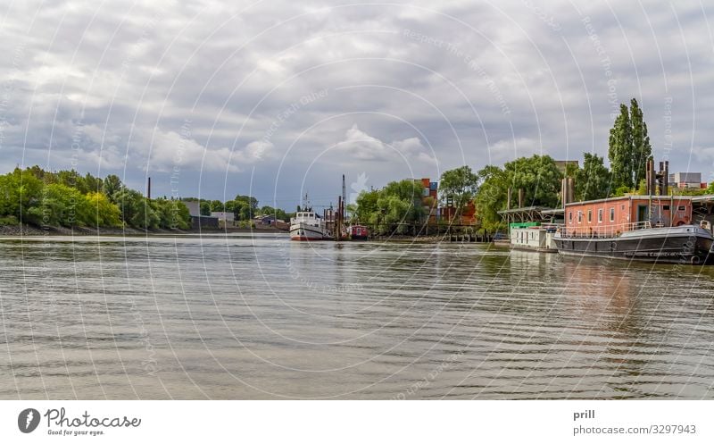 around Port of Hamburg Water Clouds Bushes Coast Brook River Port City Harbour Transport Watercraft Authentic Elbe Germany Northern Germany bank Drop anchor