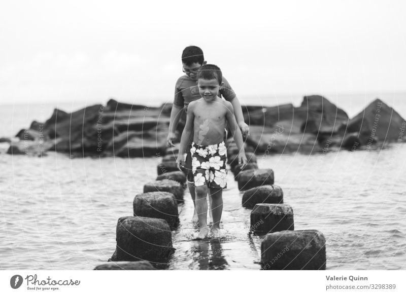 Beach Explorers Child Boy (child) 2 Human being 3 - 8 years Infancy 8 - 13 years Sand Water Swimming trunks Stone Natural Adventure Vacation & Travel