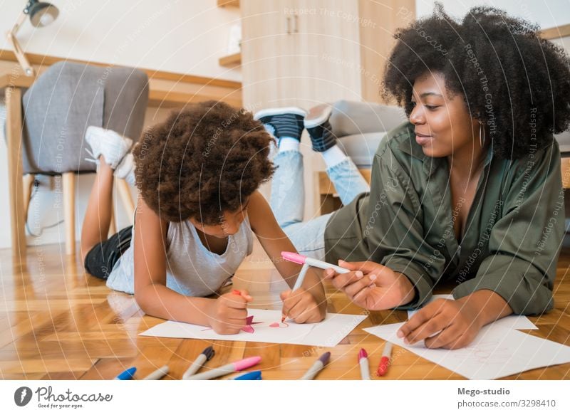 Mother and son drawing with colored pencils on floor. Joy Happy Living room Child School Boy (child) Woman Adults Parents Family & Relations Infancy Hand Art