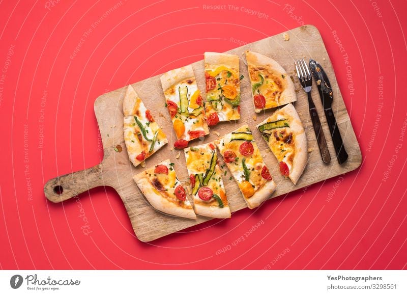 Sliced pizza primavera on wooden board. Spring pizza Vegetable Dinner Italian Food Cutlery Healthy Eating Fresh Delicious Tradition Mediterranean food