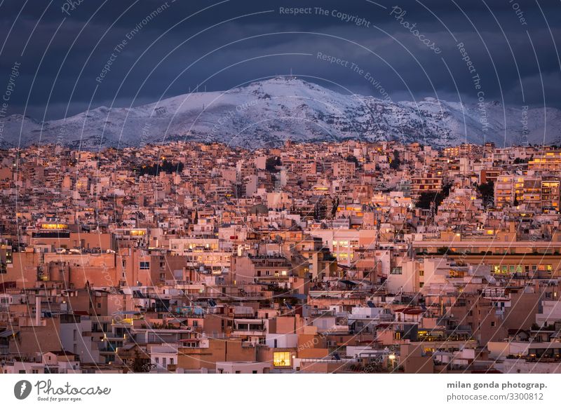 Athens. Winter Snow Mountain Cold Europe Mediterranean Greece Greek Attica Areopagus cityscape Dusk Penteli Pentelicus City urban Evening