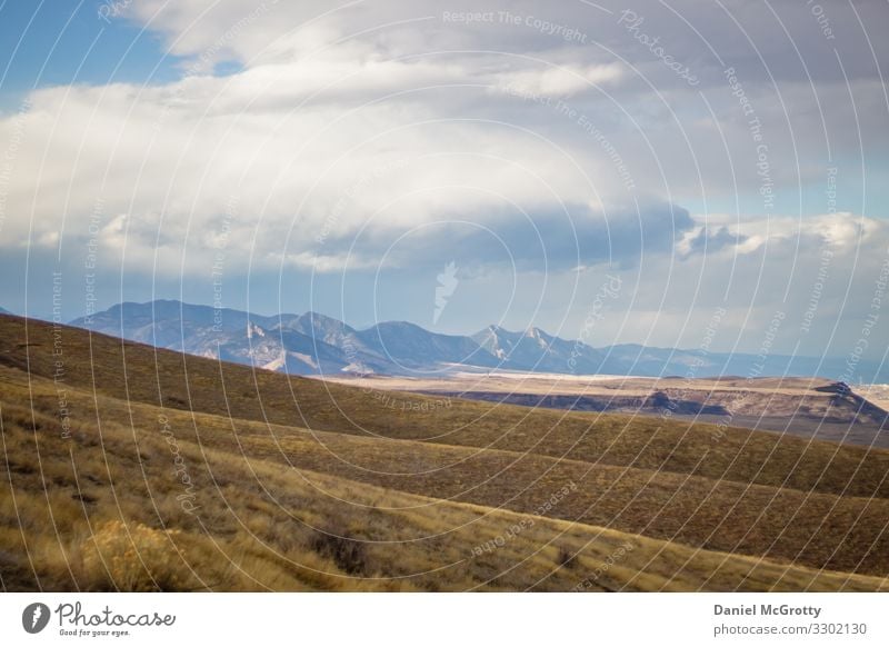 Rocky Mountain Landscape with Rolling Hills Nature Earth Sky Clouds Autumn Winter Beautiful weather Plant Grass Rocky Mountains Adventure Colorado Yellow Blue