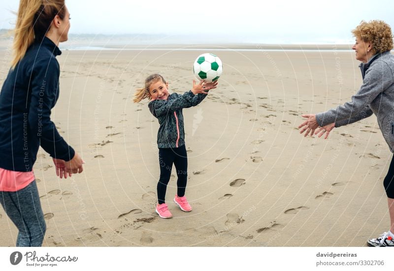 Three generations female playing on the beach Lifestyle Joy Happy Playing Beach Child Human being Woman Adults Mother Grandmother Family & Relations Sand Autumn