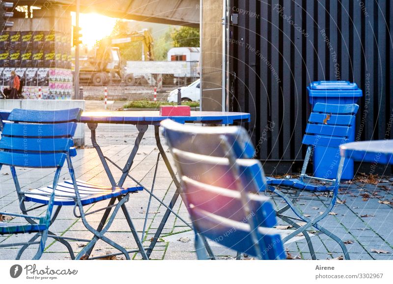 time for a beer Town Downtown Pedestrian precinct Relaxation Sit Wait Blue To enjoy Café Tavern Gastronomy Group of chairs Garden chair Garden table Terrace