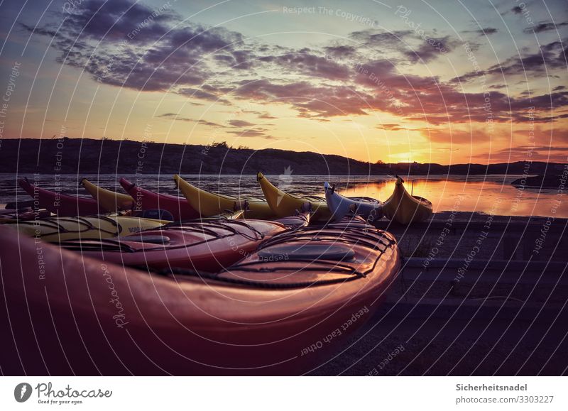 Kayaks at sunset Aquatics Water Clouds Sunrise Sunset Summer Beautiful weather Hill Coast Bay Contentment Serene Calm Sweden Colour photo Exterior shot Deserted