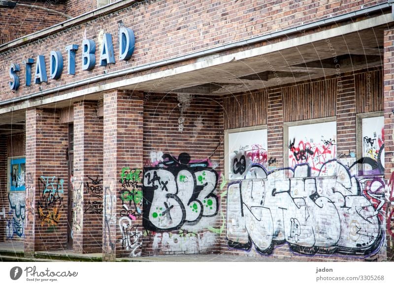 CITY POOL urban spa indoor pool Derelict forsake sb./sth. ruinous Transience Change lost places Ravages of time Decline Old Past Graffiti Building Bauhaus style