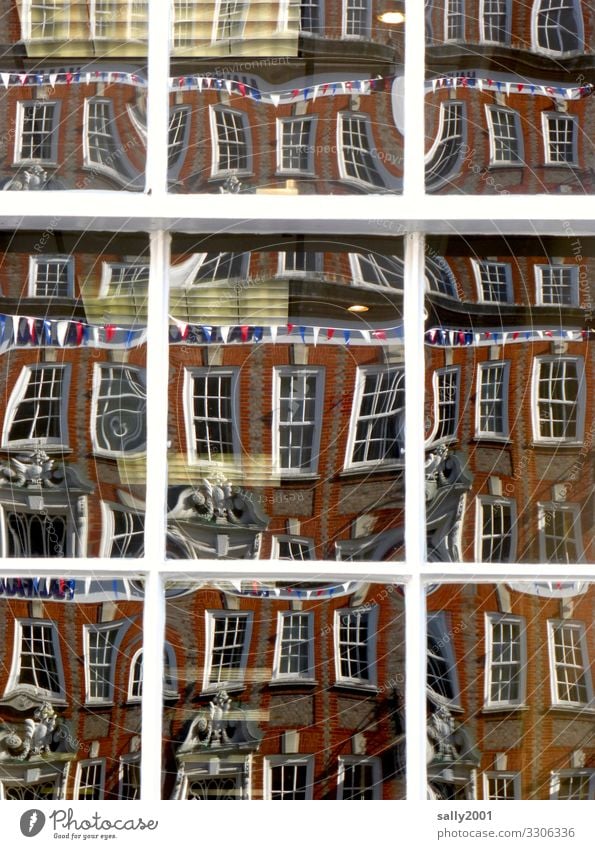 mirror distorted... Mirror Window reflection flag Tricolor Lattice window Brick Brick building Brick facade warped surreal Deferred England disheveling tousled