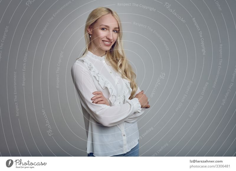 Young smiling blond woman with her arms folded Face Decoration Woman Adults 1 Human being 18 - 30 years Youth (Young adults) Blonde Long-haired Smiling