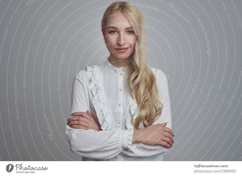 Young long-haired blond woman with her arms folded Face Decoration Woman Adults 1 Human being 18 - 30 years Youth (Young adults) Blonde Long-haired Smiling