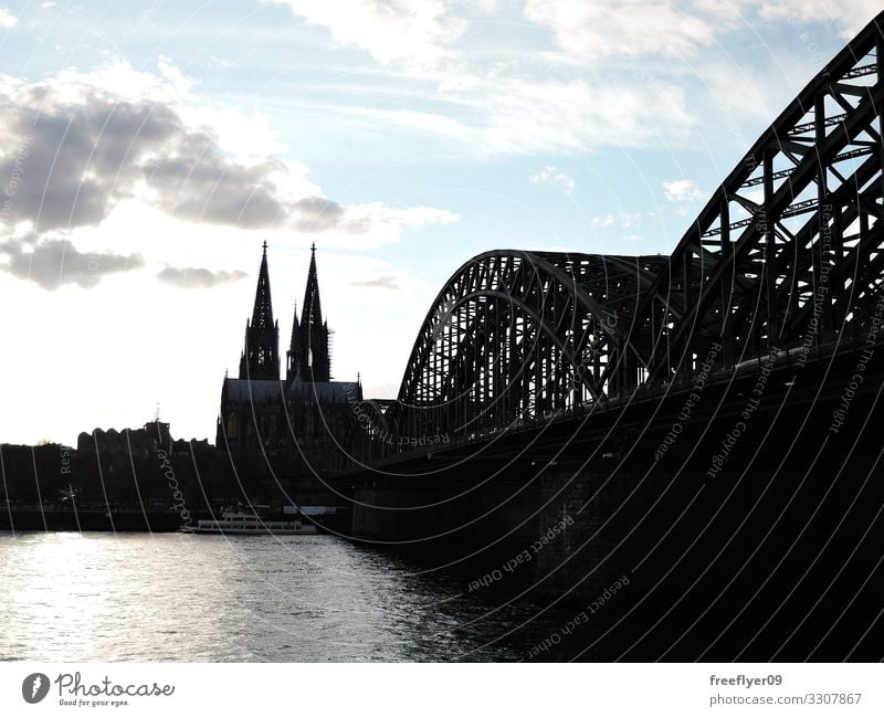 Silhouette of the Cologne Cathedral and its surrounding Sun Warmth Germany Skyline Church City hall Bridge Building Tall urban cityscape Rhine cupola panorama