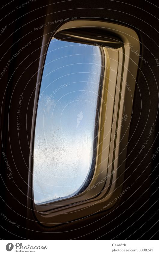 airplane window with frost on the glass isolated Vacation & Travel Wallpaper Sky Porthole Blue Black Airplane window background Story Hoar frost ice