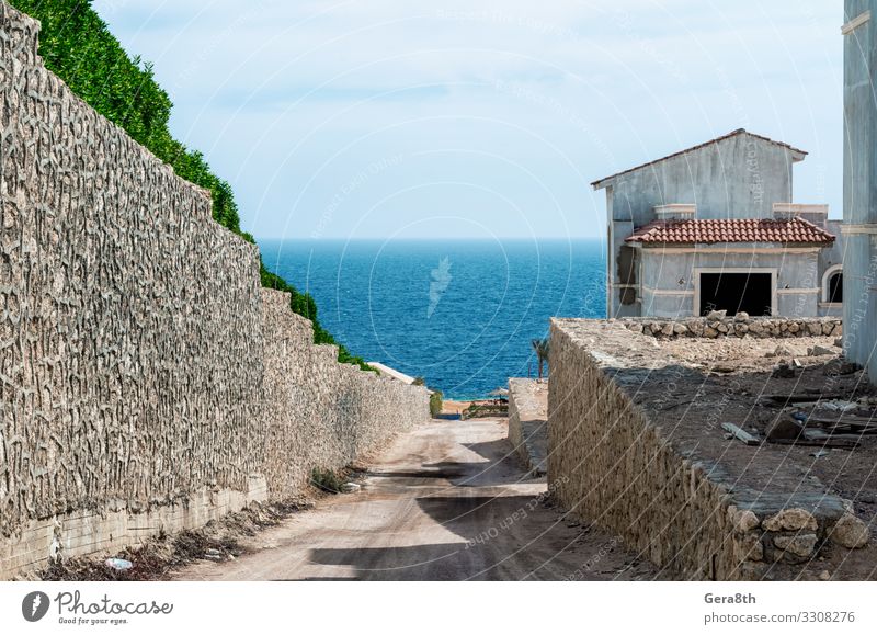 abandoned hotel on a street without people in Egypt Exotic Vacation & Travel Tourism Trip Ocean House (Residential Structure) Nature Sky Clouds Building