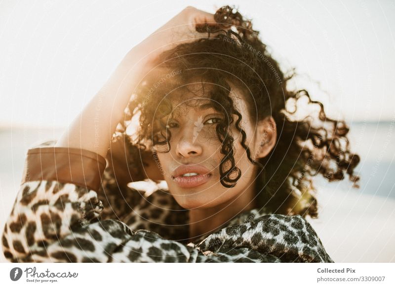 Bautiful portraist of a brown woman with black curly hair Lifestyle Beautiful Hair and hairstyles Skin Healthy Health care Wellness Vacation & Travel Tourism