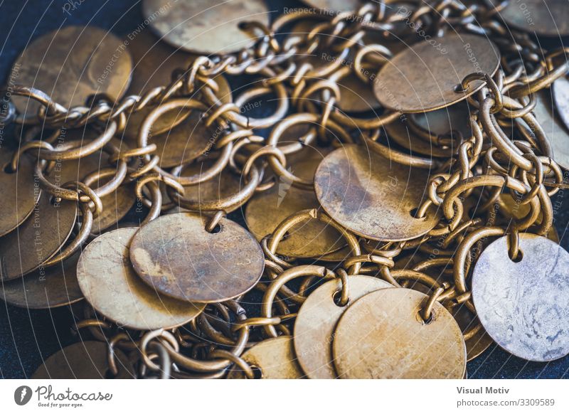 Close-up of a boho style bracelet with golden circular small discs Work of art Metal Ornament Esthetic Authentic Hip & trendy Beautiful Original Design