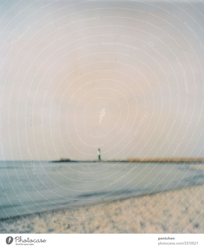 Warnemünde. Blurred beach with lighthouse and sea Vacation & Travel Tourism Trip Far-off places Freedom Summer Summer vacation Environment Nature Landscape