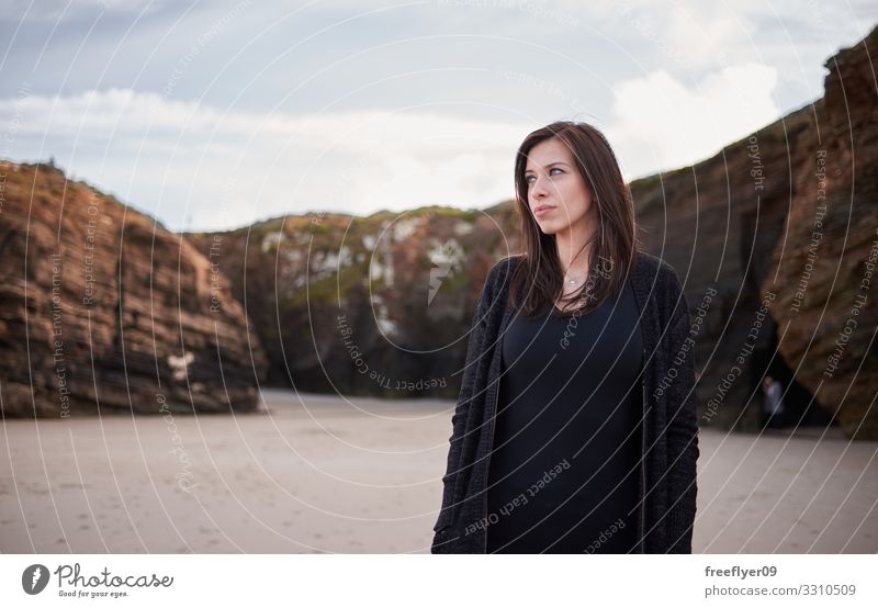 Portrait of a woman walking by Playa Catedrales in Galicia Beautiful Vacation & Travel Adventure Beach Ocean Winter Hiking Woman Adults Nature Landscape Sand