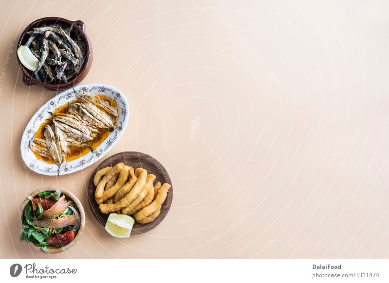 Mixed of fish ( cuttlefish, sardines, fried, salad with salmon) Seafood Lunch Dinner Plate Ocean Restaurant Fresh Delicious White Tradition anchovy appetizer