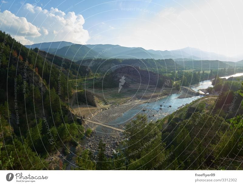 Landscape view of a river with a wood bridge over it Beautiful Vacation & Travel Tourism Adventure Summer Mountain Hiking Environment Nature Sky Clouds Tree