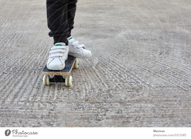 Kid skateboarder doing a skateboard ride. Lifestyle Joy Sports Child Human being Boy (child) Youth (Young adults) Park Street Jeans Skateboard Skateboarding