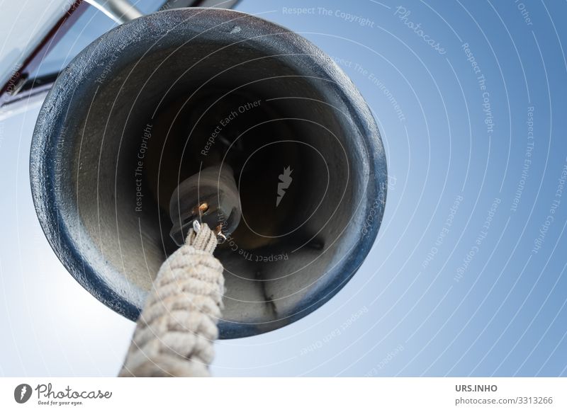 Ship's bell seen from inside in front of a blue cloudless sky Navigation Metal Blue Gray Curiosity Tradition Time "Bell". Rope chime ring Chrome Warn alert