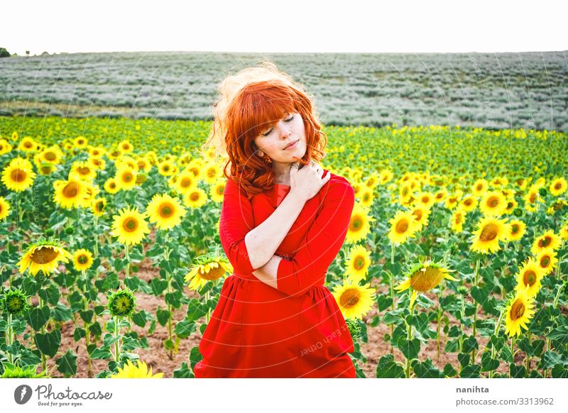 Lovely redhead woman enjoying the day in a field o sunflowers Lifestyle Style Joy Beautiful Freedom Summer Human being Feminine Young woman Youth (Young adults)