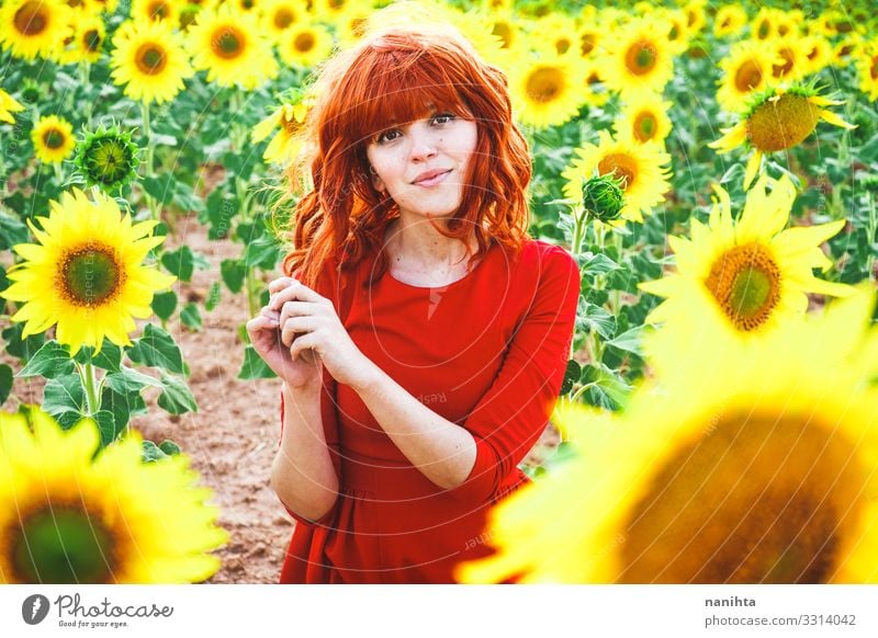 Lovely redhead woman enjoying the day in a field o sunflowers Lifestyle Style Joy Beautiful Freedom Summer Human being Feminine Young woman Youth (Young adults)