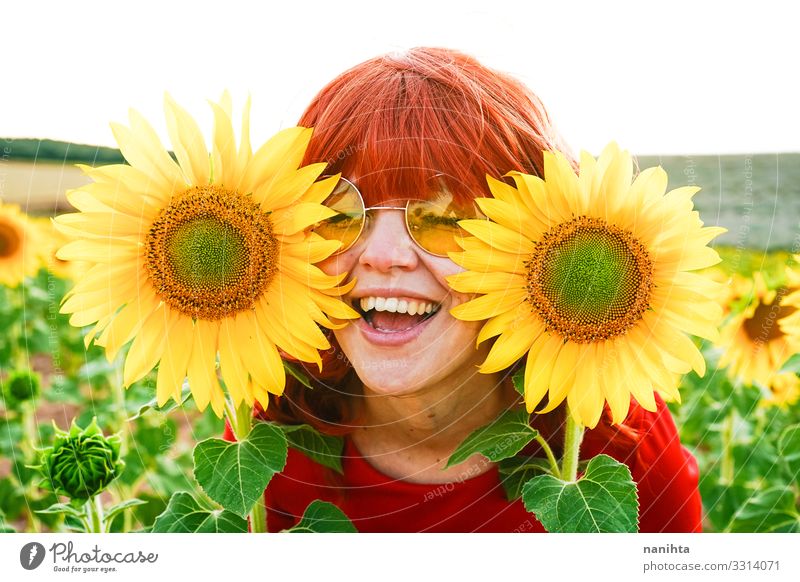 Lovely redhead woman enjoying the day in a field o sunflowers Lifestyle Style Joy Beautiful Freedom Summer Human being Feminine Woman Adults