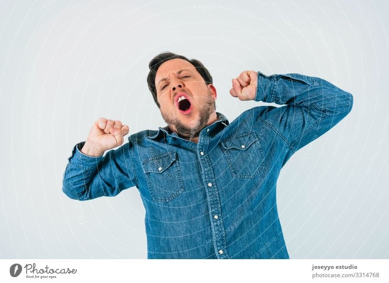 Man yawning with expression of sleep, tiredness and boredom. 30 - 45 years apathy attitude Beard Boredom Casual clothes Caucasian Denim drowsiness Exhaustion