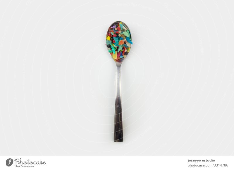 Spoon full of micro plastics. Plastic pollution concept. Ocean activists Awareness Close-up Coast damage Destruction Dirty Earth Environment Food Fragment Free