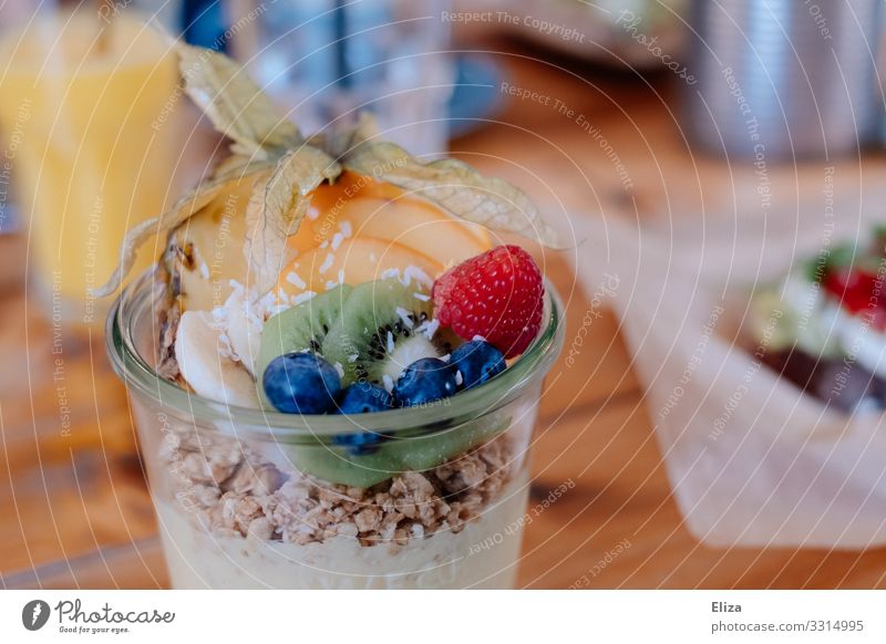 A muesli with yoghurt and fresh fruit in a preserving jar on the breakfast table Food Yoghurt Fruit Nutrition Breakfast Vegetarian diet Slow food Delicious